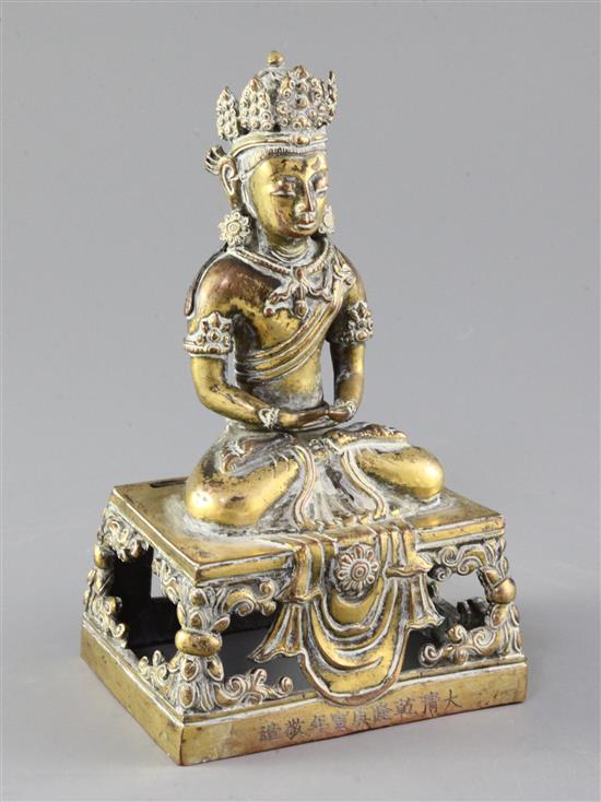 A Chinese gilt bronze figure of Amitayus, Qianlong mark and period, dated 1770, height 19cm, lacking aureole